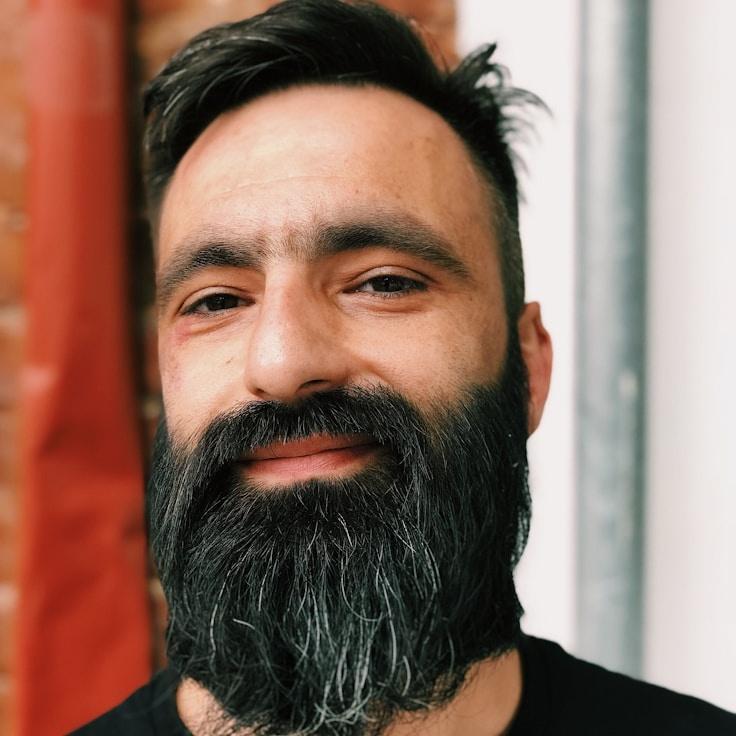 Kaveri Mehta, Lead Design Curator at Anchor Orchard Garden, reviewing corporate floral arrangements